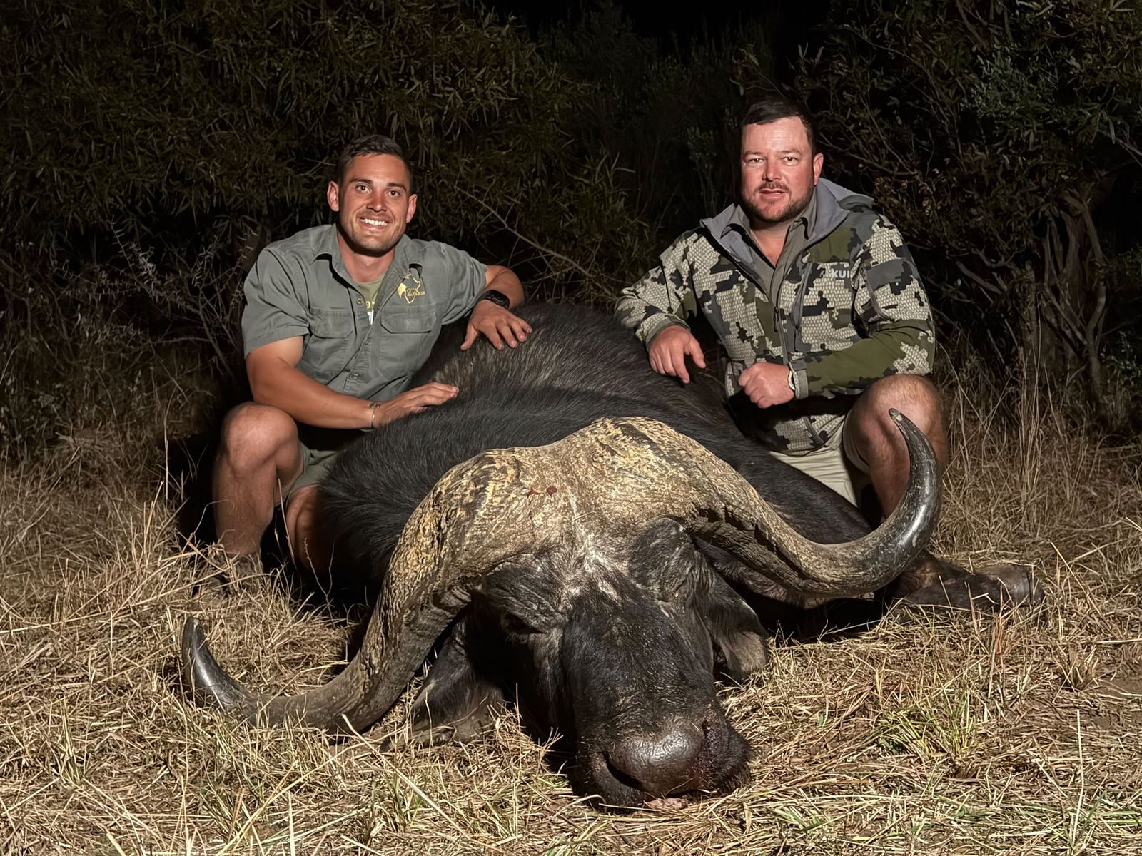 Dandre Botha and Theo Ahlers with a Cape buffalo